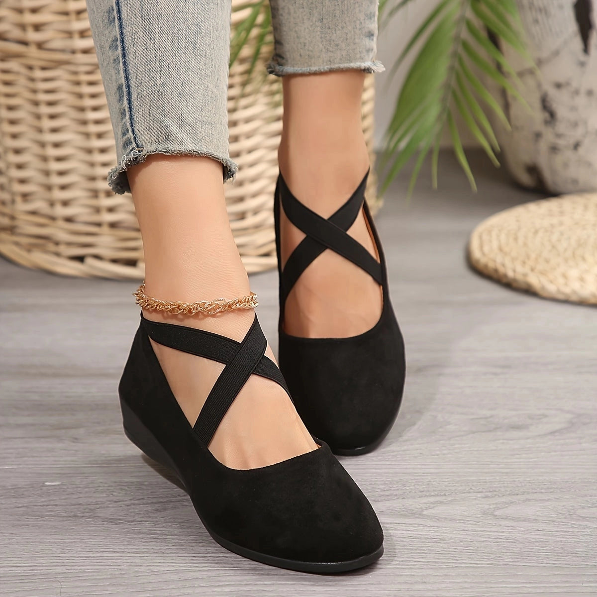 Women's comfortable blue suede cross strap ballet flats, stylish shoes showing foot and ankle.