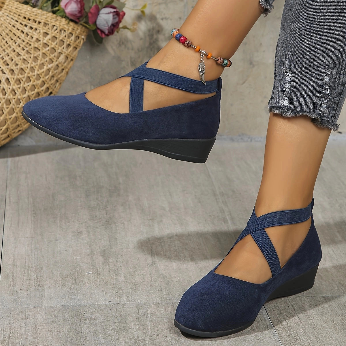 Women's Comfortable Blue Suede Cross Strap Ballet Flats with a stylish design, worn on gray background, displaying foot and leg.