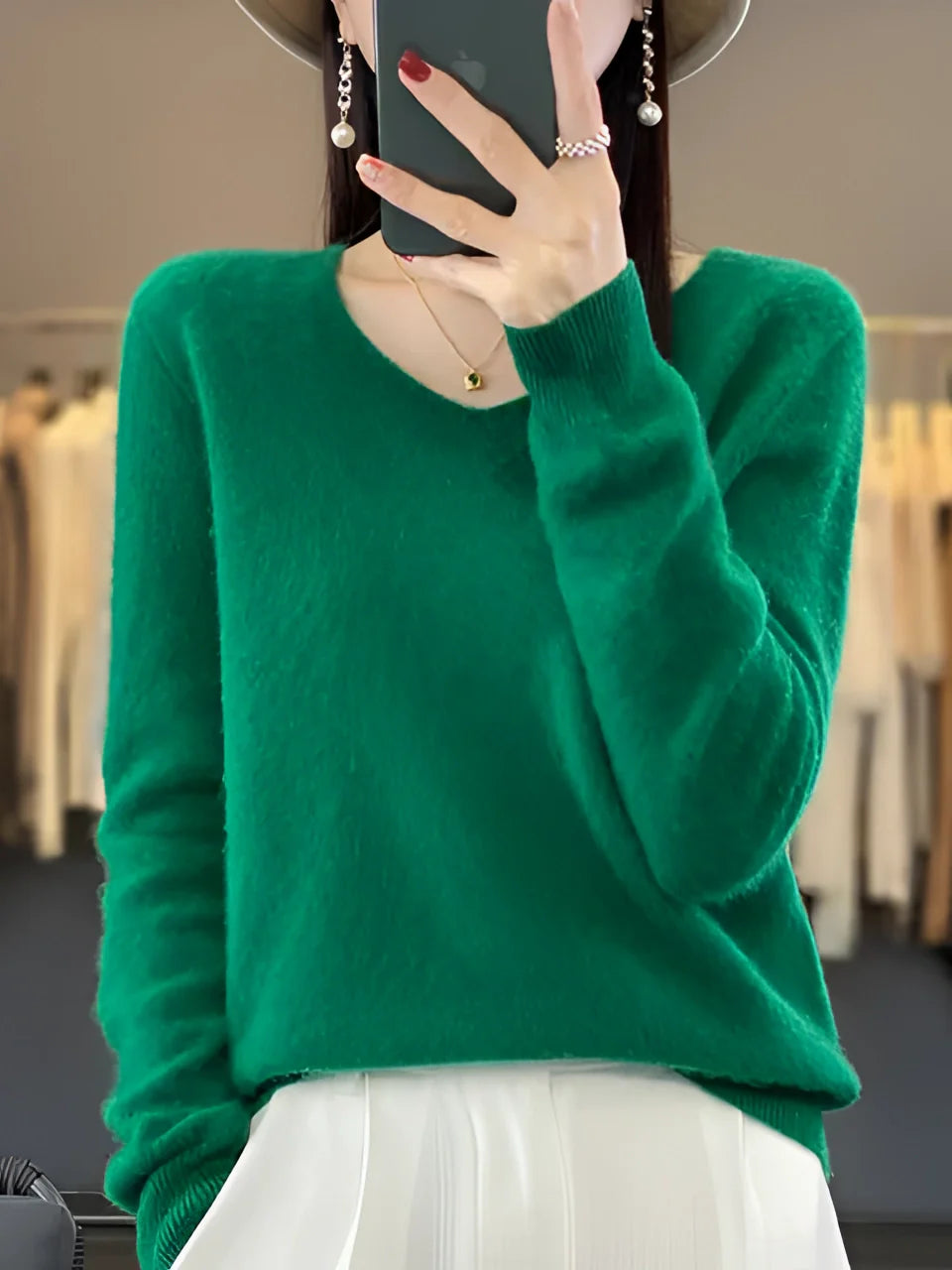 A luxurious women's emerald green cashmere sweater, soft and elegant, high-quality garment, shown in an orange color variant, size XXL, featuring long sleeves and a comfortable fit.