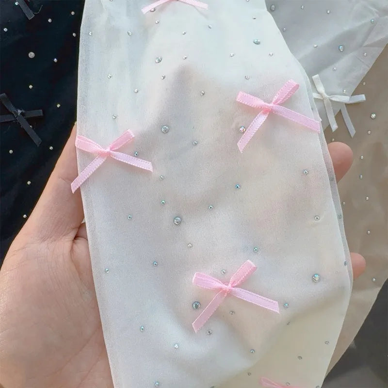 Simone | Playful tights with bow pattern