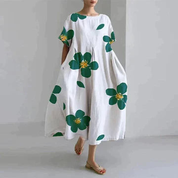 https://cdn.shopify.com/s/files/1/0741/0774/8619/files/robe-longue-blanche-fleurs-vertes.webp?v=1726495667