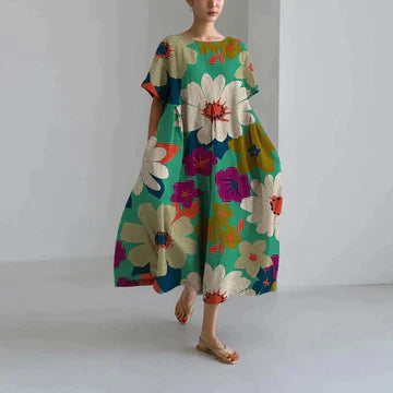 https://cdn.shopify.com/s/files/1/0741/0774/8619/files/robe-longue-verte-fleurs-multicolores.webp?v=1726495667